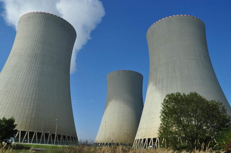 Low angle shot of Temelin nuclear power plants with blue sky above, Czech Republic